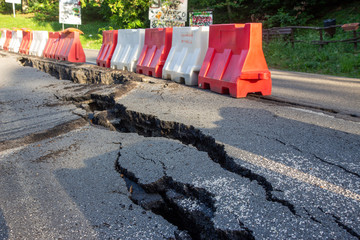 Landslide hit by flooding and road subsidence