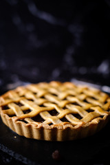 Homemade rustic pastry Traditional Raisin Pie tart cake.