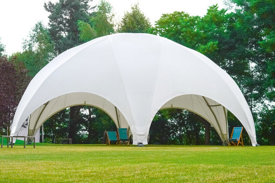 Round, white awning for relaxing,  carrying out activities in nature