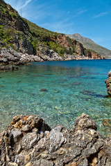 Fototapeta na wymiar The seashore at Cala Beretta in the Oasi dello Zingaro natural reserve, San Vito Lo Capo, Sicily