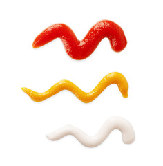 Splashes of tomato ketchup, mayonnaise and mustard isolated on white background, top view