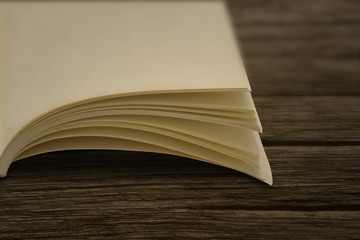 blurred book section on the wooden table
