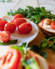 cherry tomatoes and parsley and bruschetta with mozzarella