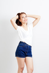 woman thai in t-shirt and jeans wall background