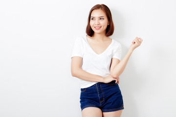 woman thai in t-shirt and jeans wall background