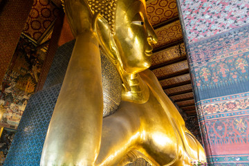 Bangkok, Thailand. 06/22/2019; Reclining Buddha  in Wat Pho is the Famous of Buddha stature in...