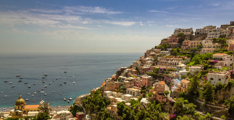 Fototapeta na wymiar Positano Hill View. Beautiful view of Positano at daytime, with its colorful buildings along the hill. Amalfi coast situated in province of Salerno, in the region of Campania, Italy.