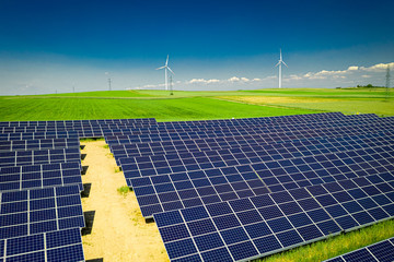Flying above stunning view of solar panels in sunny day