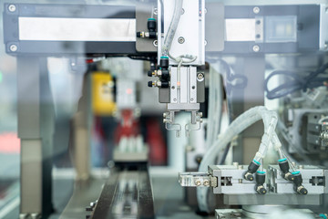 automation machine and detail close up in machine automatic with robotic automation technology for technology production factory