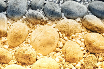 Two-color texture of large and small stones, toned in yellow