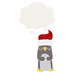 cartoon christmas penguin and thought bubble in retro style