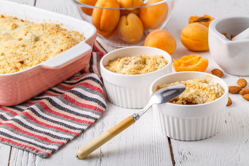 Homemade apricot crubble tart on table
