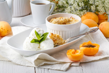 Freshly baked crumble with vanilla ice cream