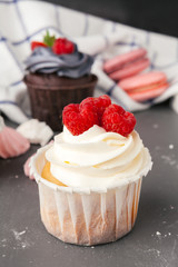 Delicious raspberry cupcakes on dark background - Handmade Sweet dessert