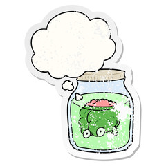 cartoon spooky brain in jar and thought bubble as a distressed worn sticker