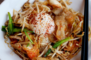 Buta Kimchi  (Pork and Kimchi Stir-fry with onsen tamago egg)  , a milder Japanese version of the Korean dish Jaeyook Bokkeum .