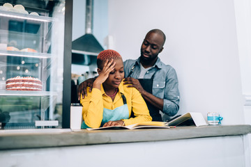Barista supporting exhausted colleague