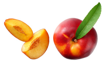 Nectarine with green leaf and slices isolated on white background. top view