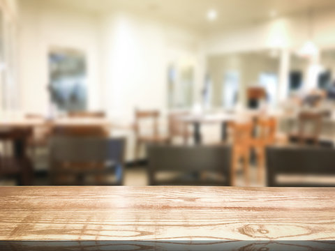 Blur restaurant or desserts cafe interior store background. Wooden shelf backdrops for design.