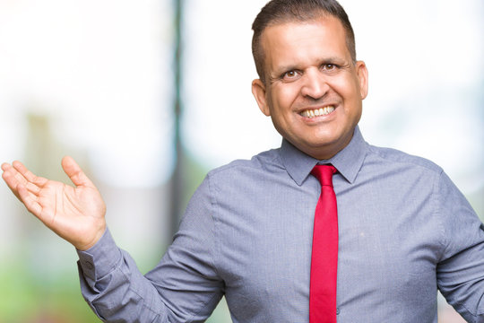 Middle age arab man wearing red tie over isolated background clueless and confused expression with arms and hands raised. Doubt concept.