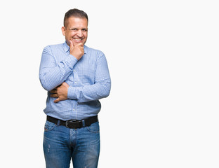 Middle age arab business man over isolated background looking confident at the camera with smile with crossed arms and hand raised on chin. Thinking positive.