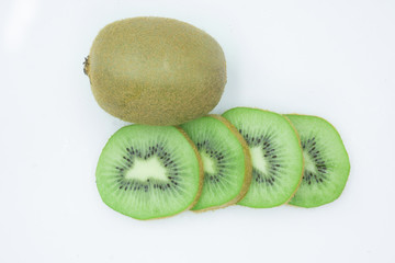 Ripe whole kiwi fruit and half kiwi fruit isolated on white background