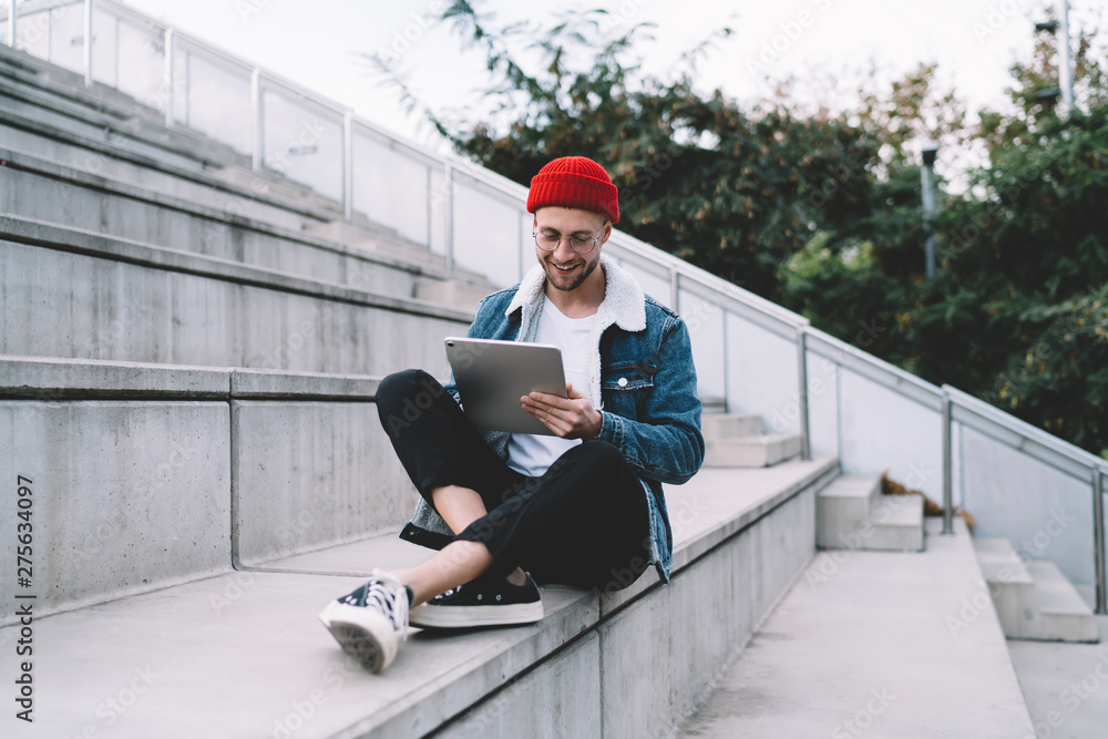 Poster happy hipster blogger typing content text for publicate and attract new followers to own website for