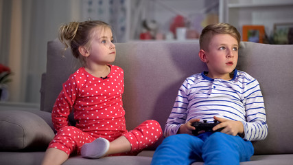 Parents catching children playing game at night, discipline control, behavior