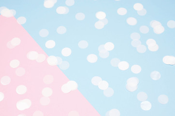 The background is pink-blue with a round white metaphane.