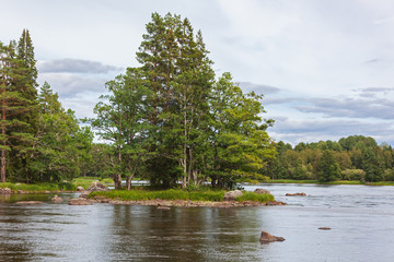 Summer north landscape with river and forest before a rain. Farnebofjarden national park in Sweden
