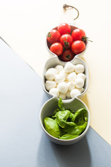 Mini mozzarella cheese, tomatoes and green basil.