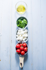 Mini mozzarella cheese, tomatoes and green basil.