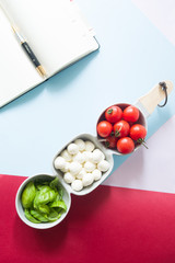 Mini mozzarella cheese, tomatoes and green basil.
