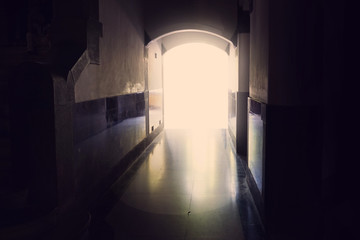 empty interior dark room with one escape way