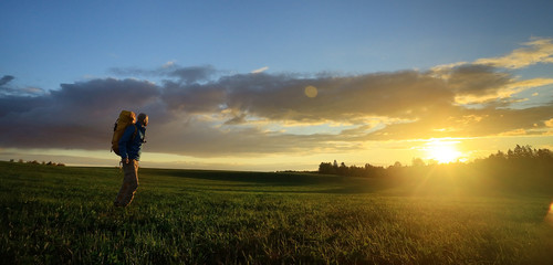 traveler man in the field, happy guy, concept freedom leisure nature, landscape beautiful place nature