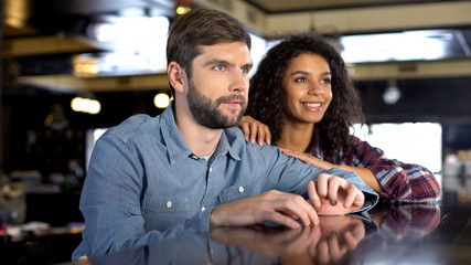 Nervous couple supporting national team, watching sport competition online