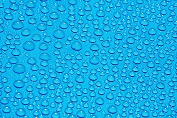 closeup drops water on blue background
