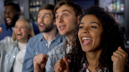 Group of young people rooting for team, national league support, event audience