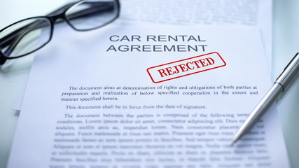 Car rental agreement rejected, seal stamped on official document, business