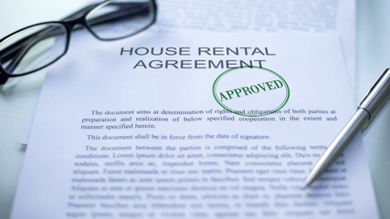 House rental agreement approved, seal stamped on official document, business