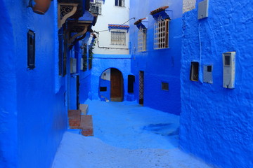 Blue street walls of the popular city of Morocco, Chefchaouen. Traditional moroccan architectural details. - 275642271