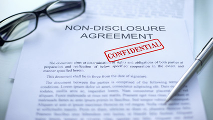Non-disclosure agreement confidential, seal stamped on official document, close