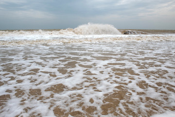 Sea during a storm. Waves against the sky. There is a place for text. Copy space. Summer concept
