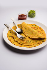 Chilla or Besan cheela is a simple pancake made with chickpea flour and some basic ingredients served with green chutney and tomato sauce, also known as veg-omelette