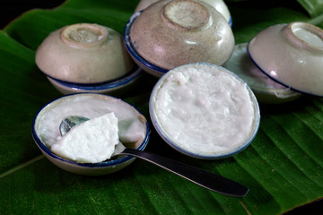 Snack cup ancient Thai dessert, in tile cup on banana leaf Do the old style