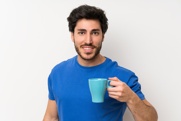 Handsome man holding hot cup of coffee