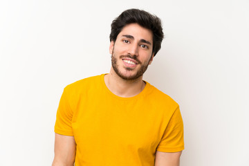 Obraz premium Handsome over isolated white wall laughing
