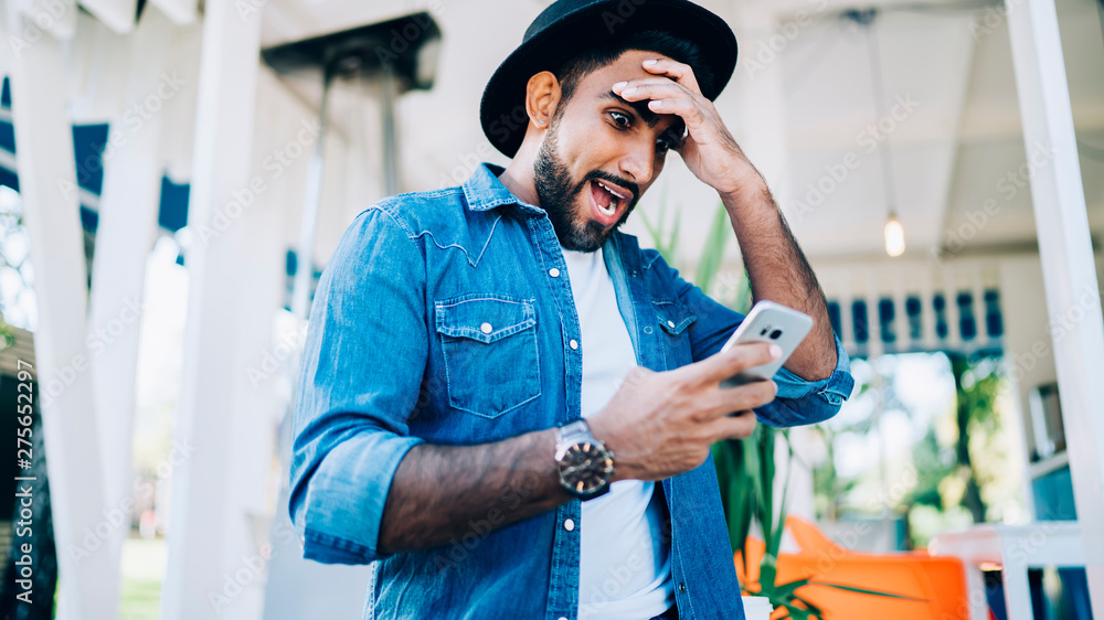 Poster stunned hipster guy shocked from bad memory and forgetting stuff while reading received email on sma