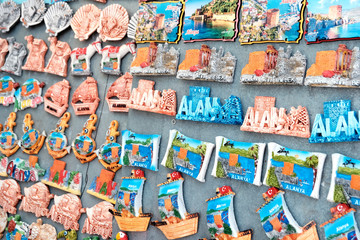 Magnets with inscriptions Turkey, Alanya in memory of the trip. Tourist shopping on the fridge. The concept of selling magnets, Souvenirs.
