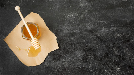 Top view honey jar with spoon